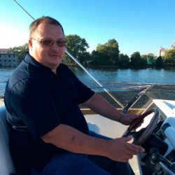 at the helm